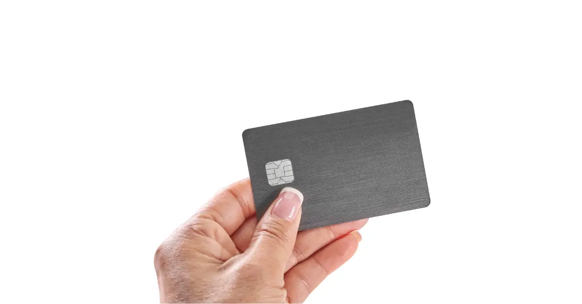 Hand holding a card with an EMV chip
