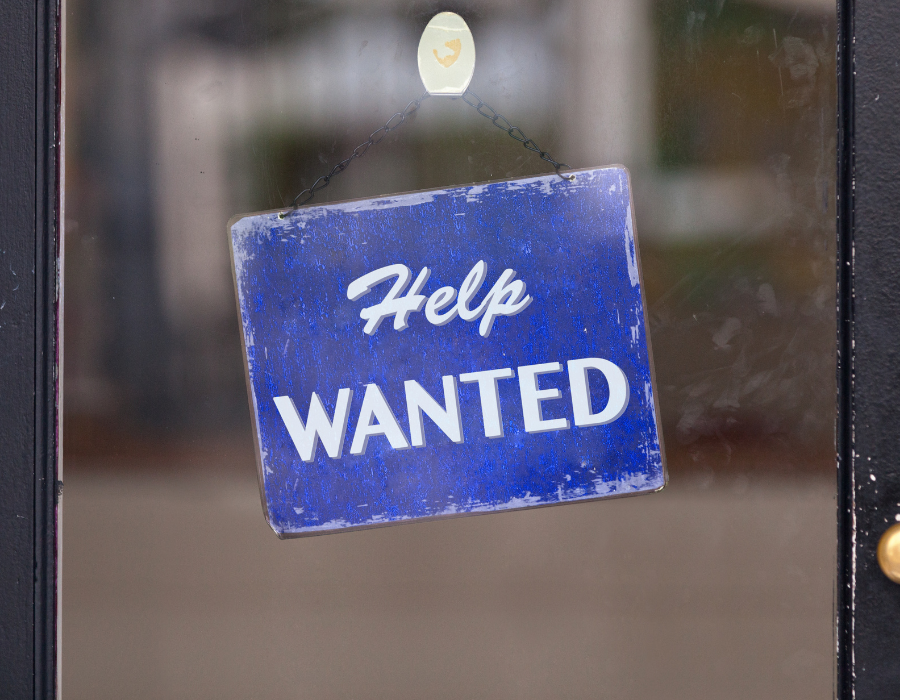 Help Wanted Sign in Window - Staff Shortages in Banking